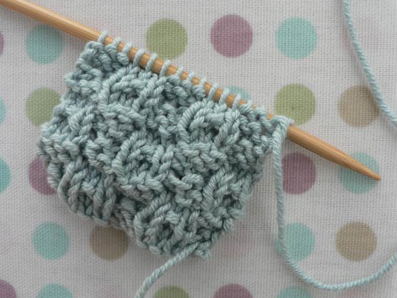 Sample of dimple knitting stitch in pale-blue cotton yarn